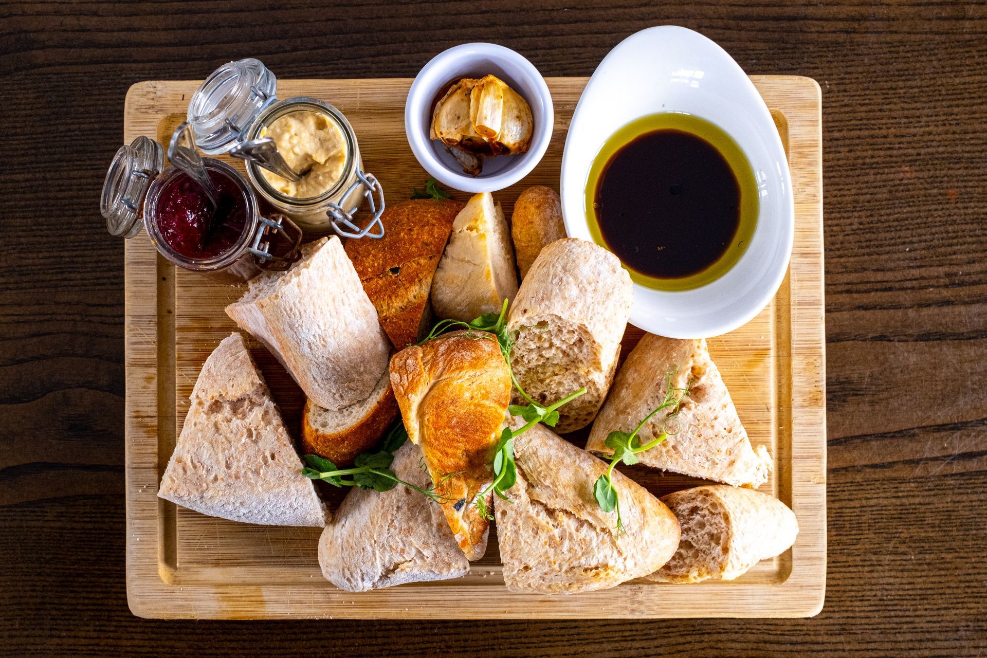 Warm artisan bread board with dips