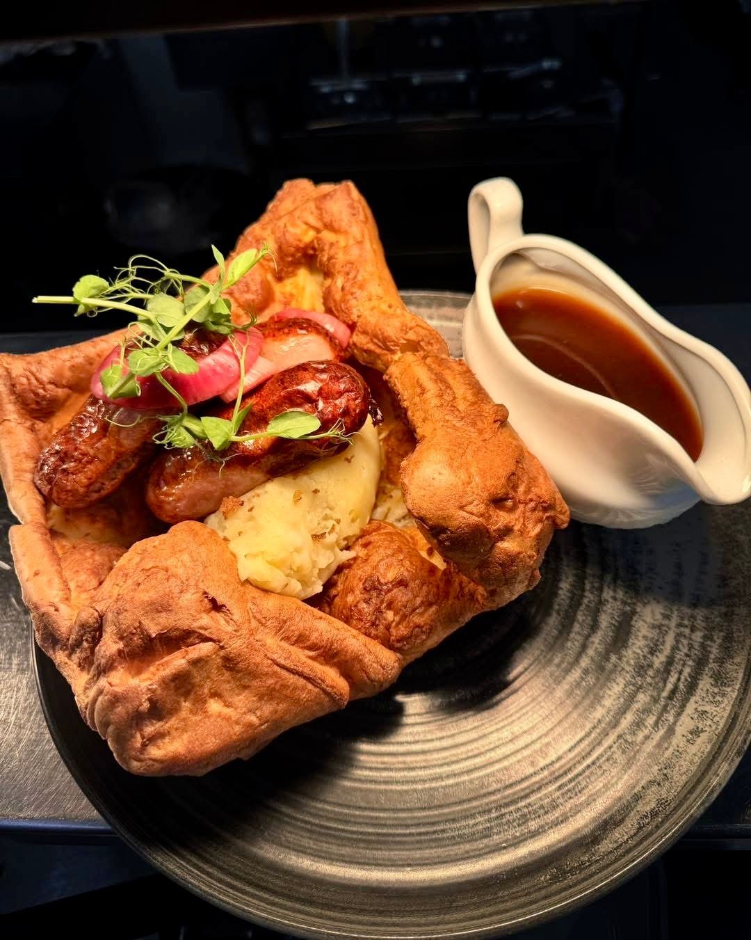 Giant Yorkshire pudding with sausages, mash and gravy